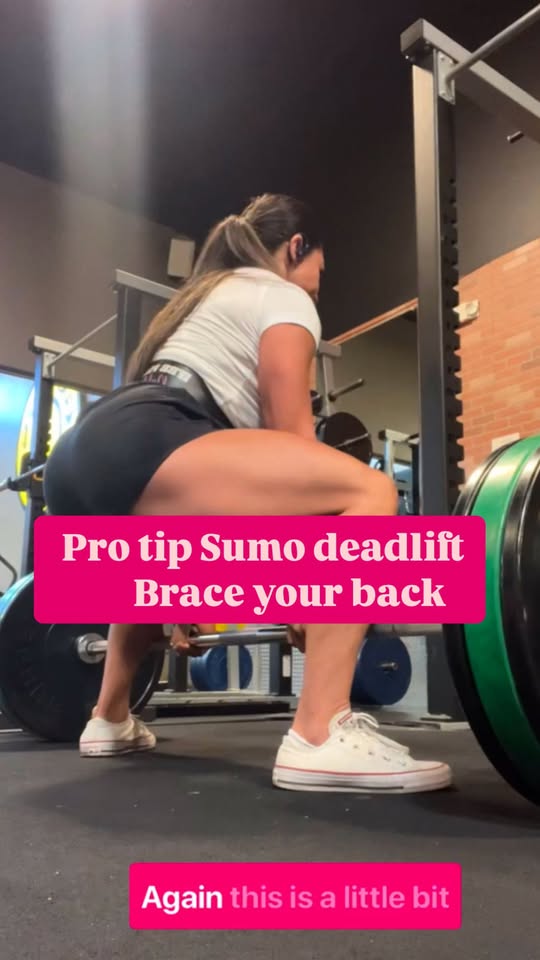 A LOVEHER member performing a sumo deadlift