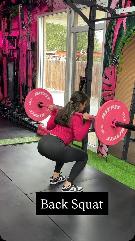 Back squat training at LOVEHER Women's Gym — coached lower-body strength
